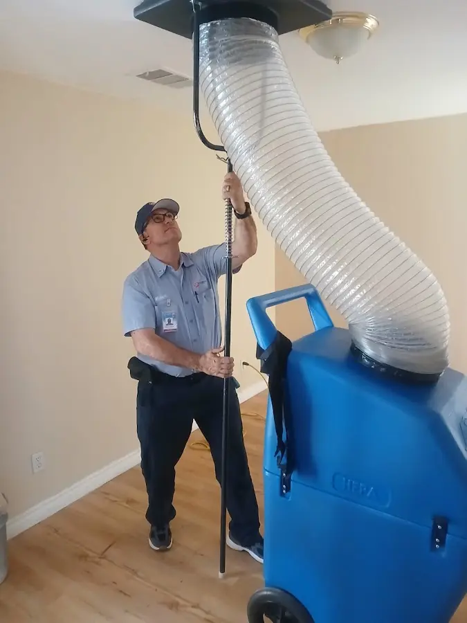 Furnace Tune-Up technician using HEPA equipment in Vestavia Hills